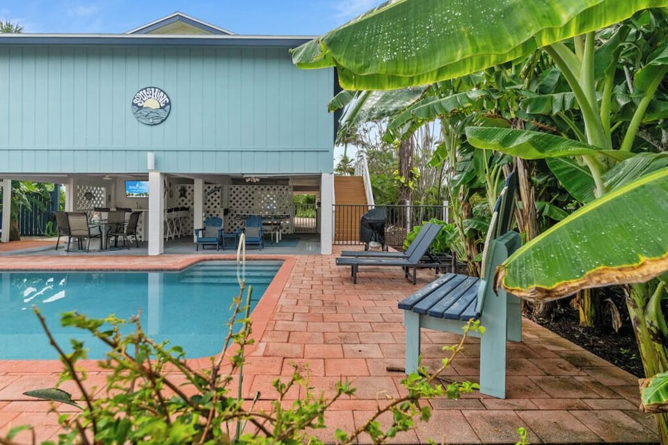 Relax in your private heated pool surrounded by tropical greenery — perfect for sun-filled days and star-lit nights.