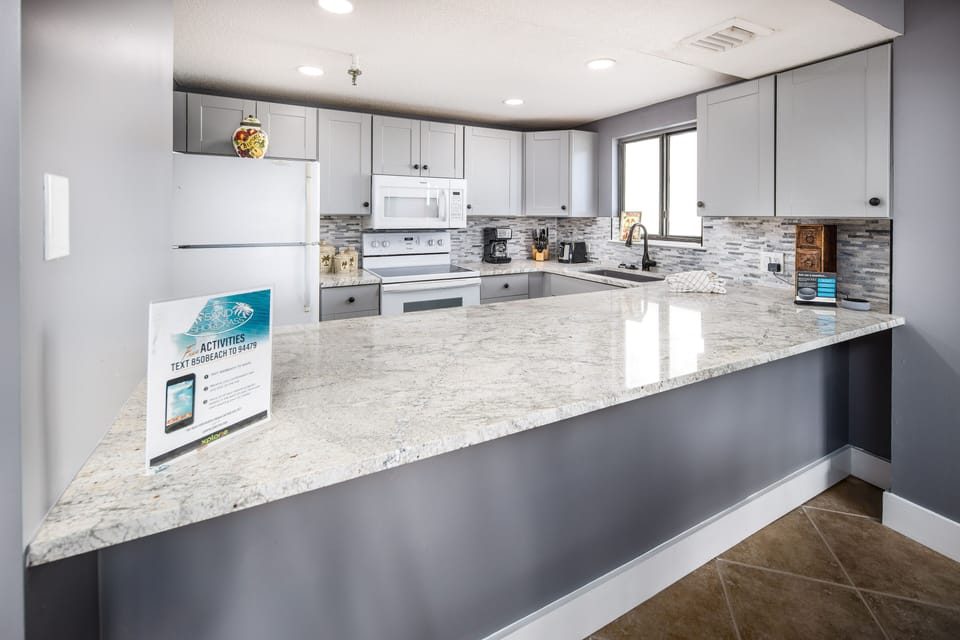 Kitchen - Granite counter tops and beautiful white cabinetry