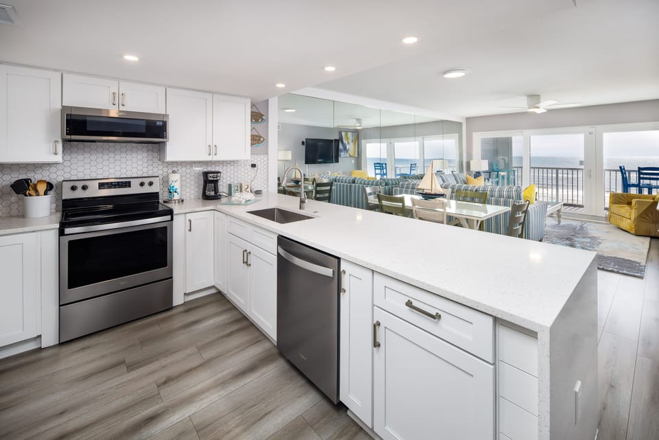Kitchen - This fully furnished kitchen with quartz countertops is a chef's dream.