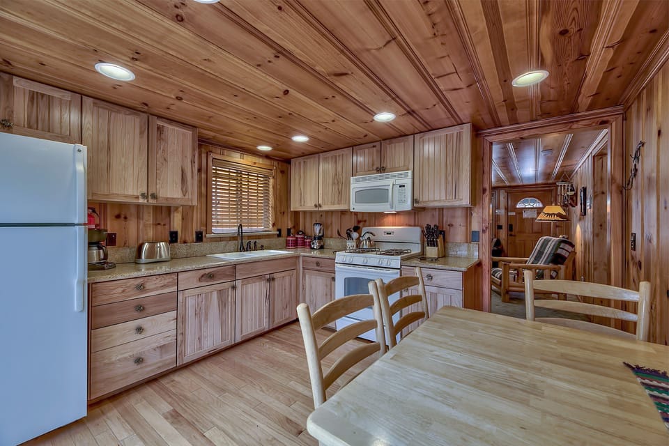 Dining for 4 at this table and quick access to the living room or back deck