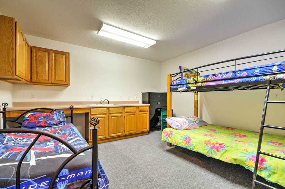 The kids will love picking their sleeping arrangements, alternating between the top and bottom bunks of the Twin-over-Twin Bunk Bed or their own individual full-sized bed!