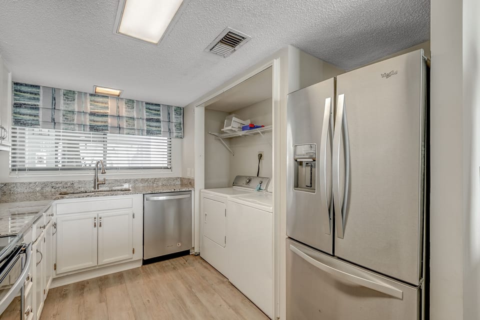 This kitchen has all you need, including a washer and dryer!