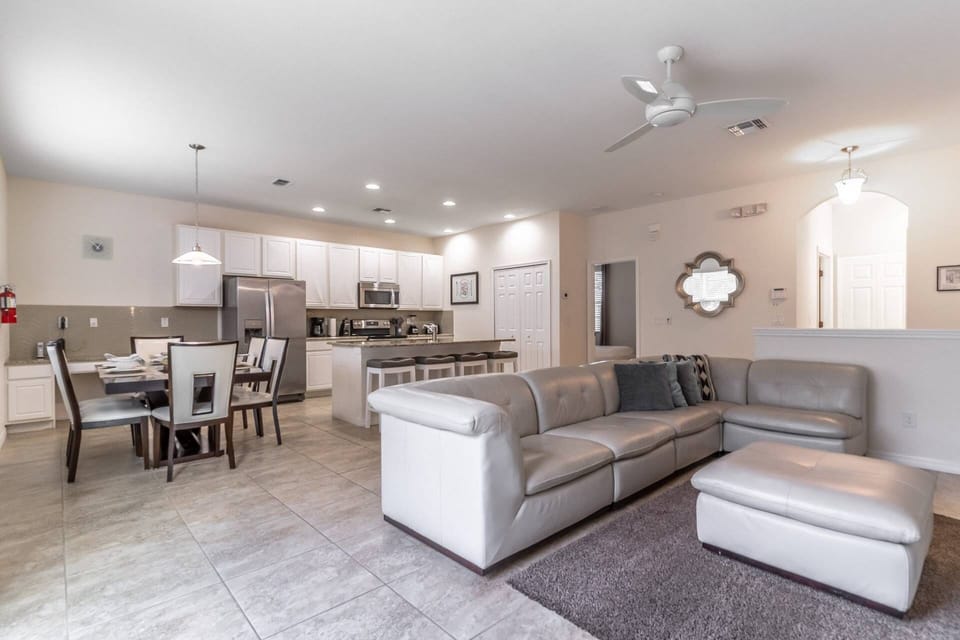 Modern, bright and inviting open concept living, dining and kitchen with access to the private pool!