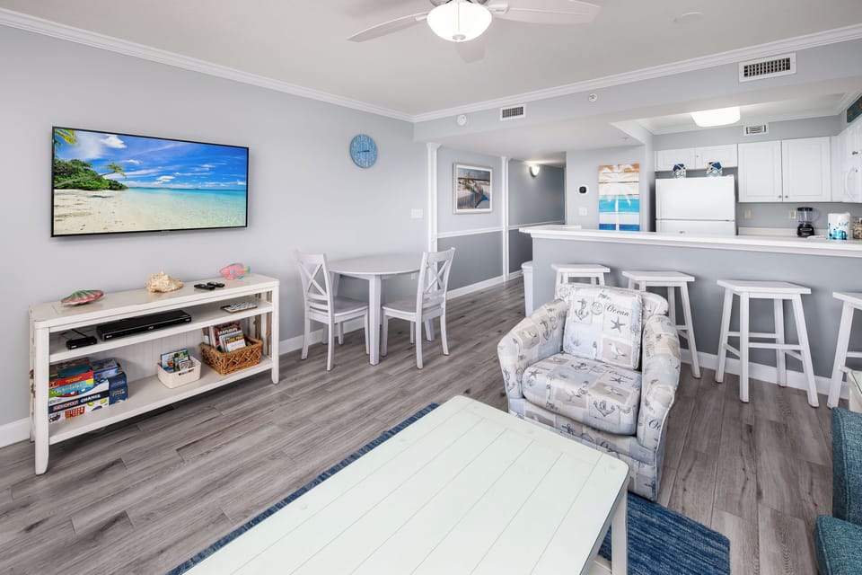 Living and Dining area view - Large flat screen tv so you can keep up with your favorite shows!
