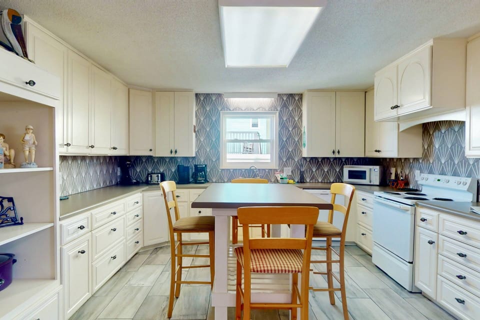 The kitchen offers plenty of counter space and island seating