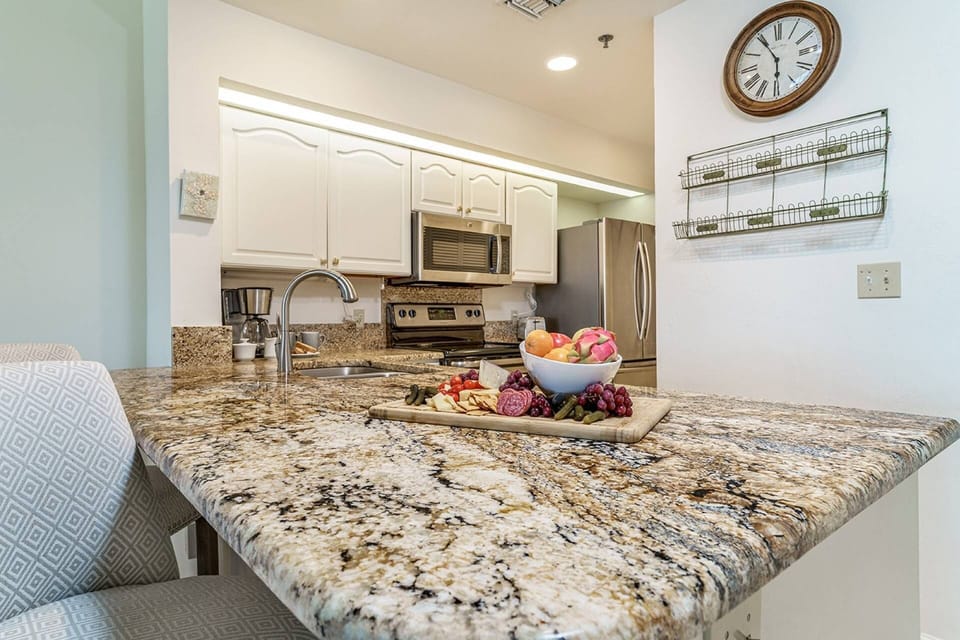 Open & Well Equipped Kitchen with Stainless Steel Appliances