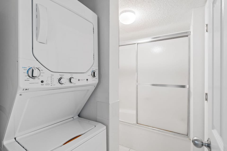 Bathroom - Washer & dryer area, as well as a tub & shower combo.