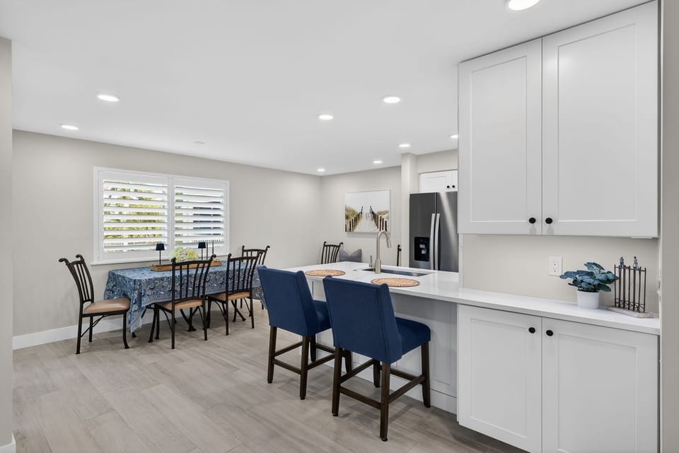 Open concept kitchen with small breakfast bar