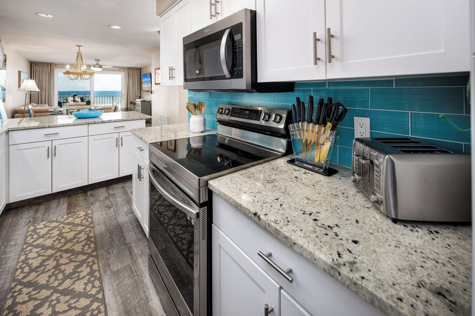Kitchen - Featuring stainless steel appliances with lots of cabinet & counter space