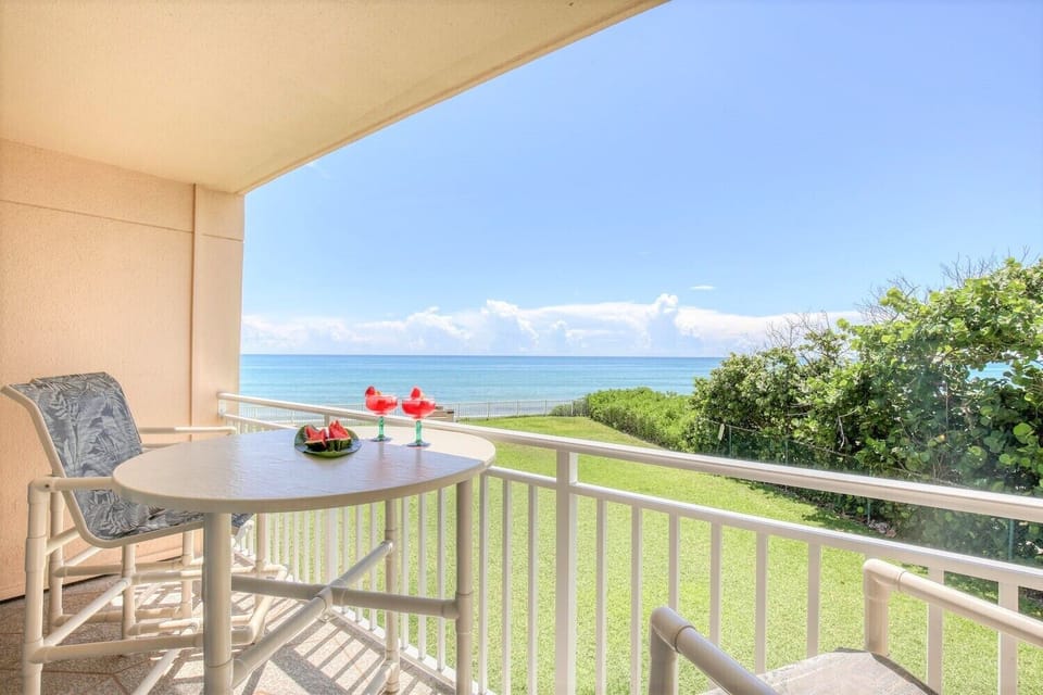 Private balcony with high-top seating, perfect for sipping coffee or wine while soaking in the view.