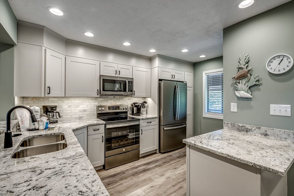 Kitchen has stainless steel appliances