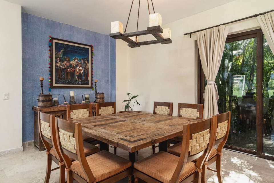 The indoor dining table has a gorgeous table and seating for 8.