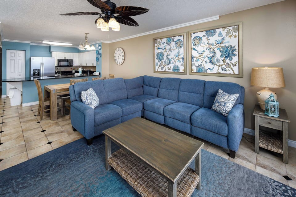 Living Room - Great open floor plan with gorgeous tile flooring that gives this unit a sophisticated and chic atmosphere throughout.