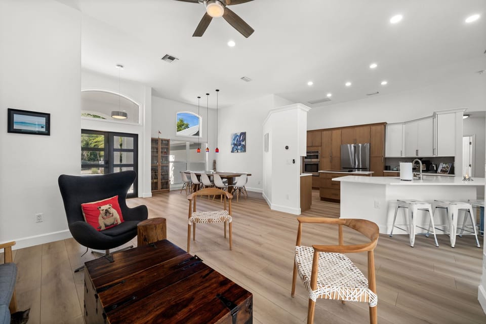 Bright, open-concept living space connecting the living room, dining area, and kitchen—perfect for gathering, relaxing, and entertaining
