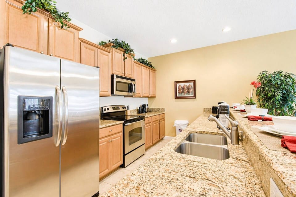 Fully equipped kitchen with granite counters and stainless steel appliances