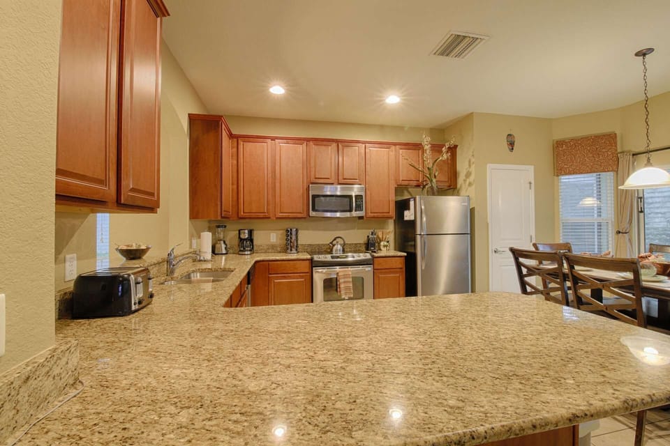 Modern Kitchen - Tile Flooring, Stainless Steel Appliances & Granite Counter Tops