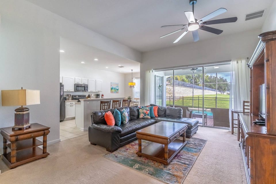 Bright and open Living, Kitchen and dining areas with access to the rear fully enclosed private pool