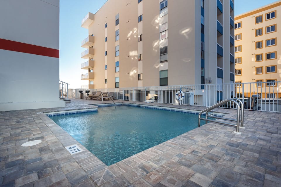 Pool - The beach is visible from The Palms' pool area, which is located on the side of the building.