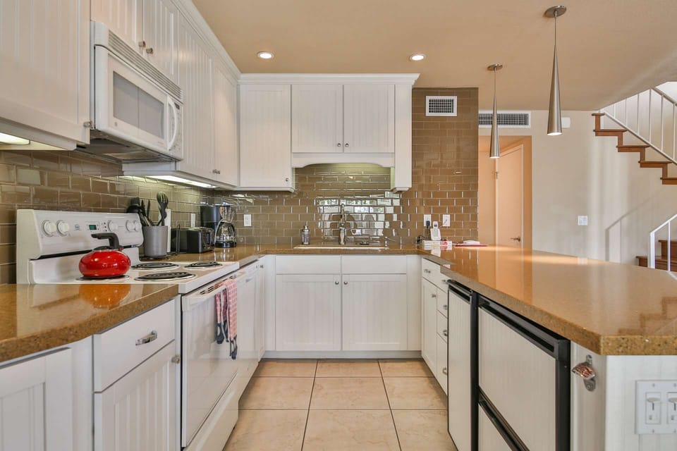 Well appointed kitchen opens to dining and living areas