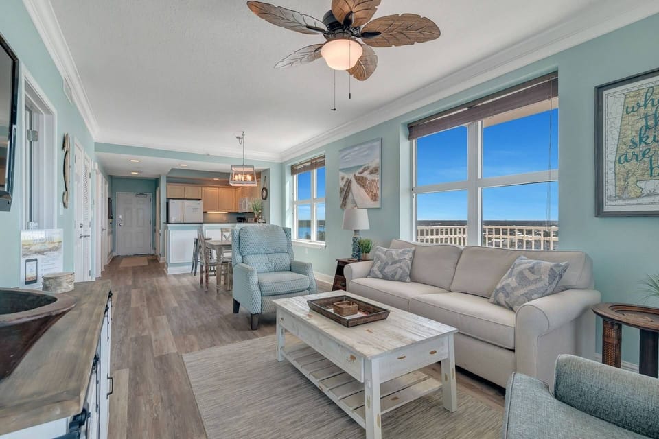 Living area with sofa sleeper, as well as dining for six at the table and breakfast bar.
