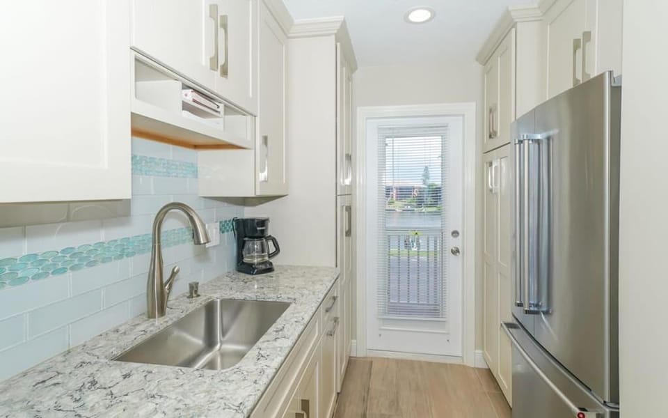 Upgraded kitchen with view of boat docks