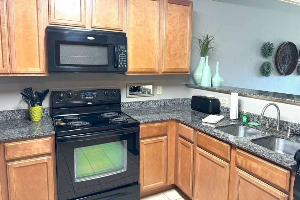 A stylish kitchen with all your basic essentials. We provide a standard 12 cup coffee maker for those early mornings!