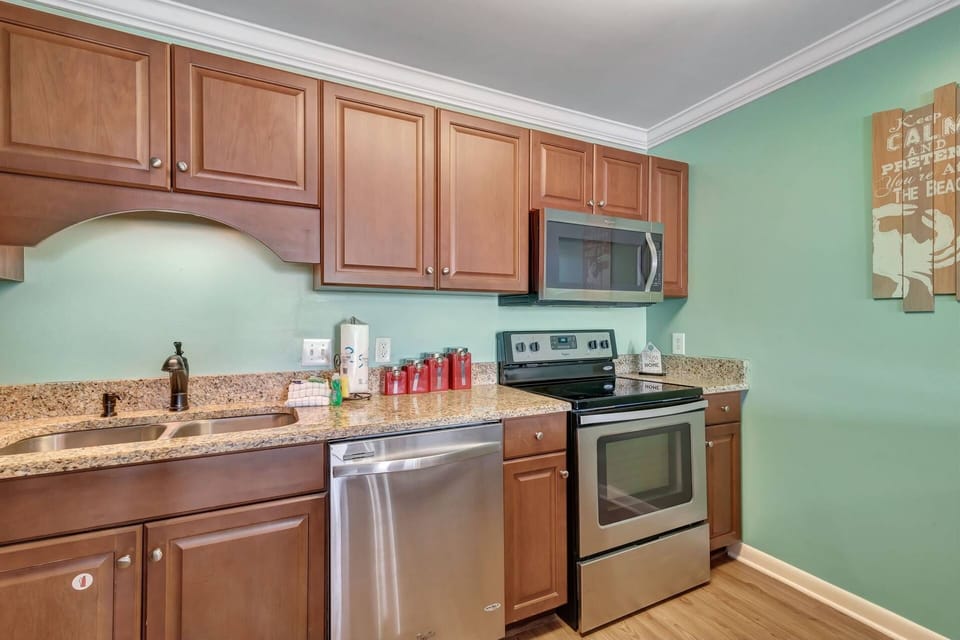 Kitchen fully equipped with large and small appliances - as well as cookware and serving essentials.