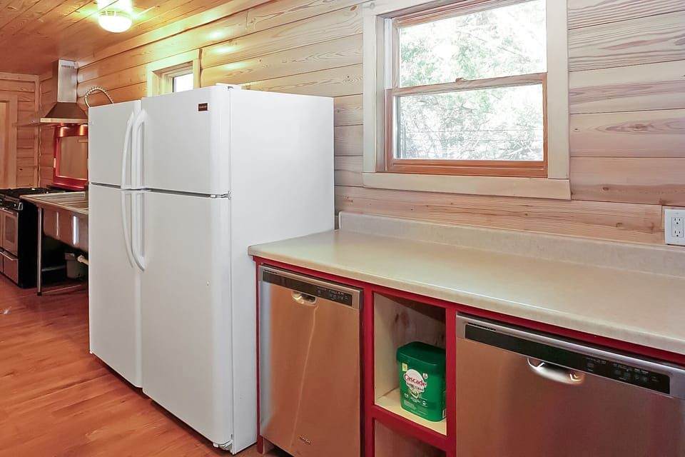 Two dishwashers and two refrigerators in the kitchen