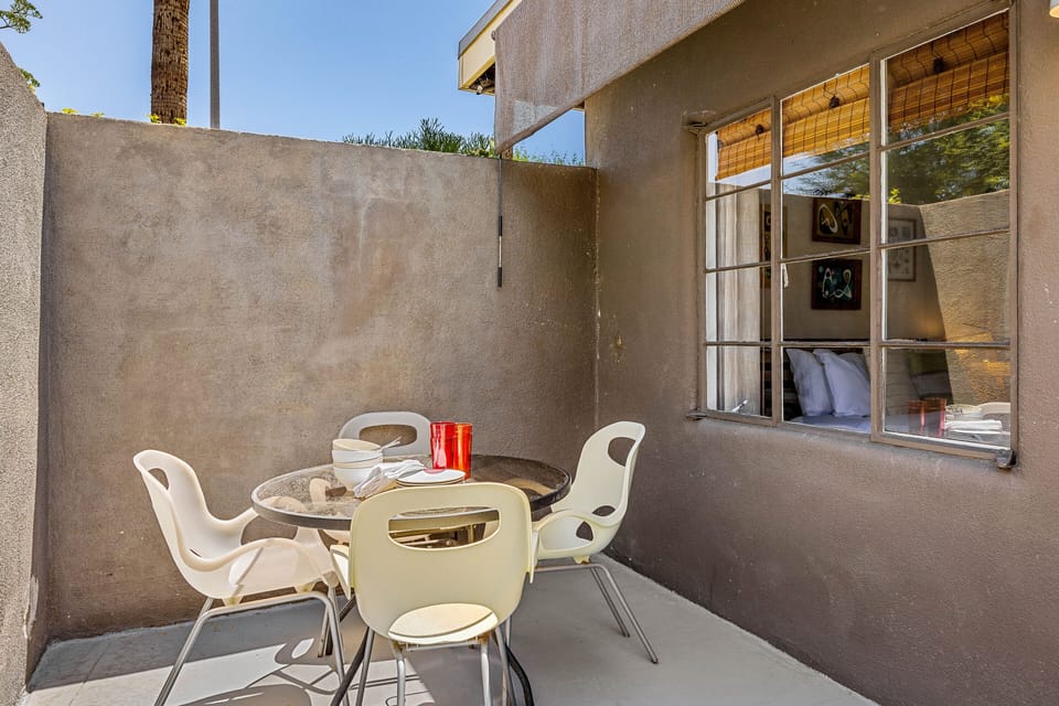 Private patio with outdoor dining set for four