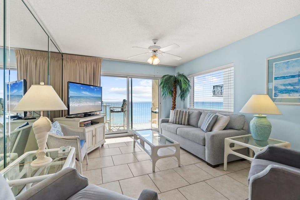 Living Room - Just steps away from your private balcony! This sofa is a sleeper to add space for two more guests.