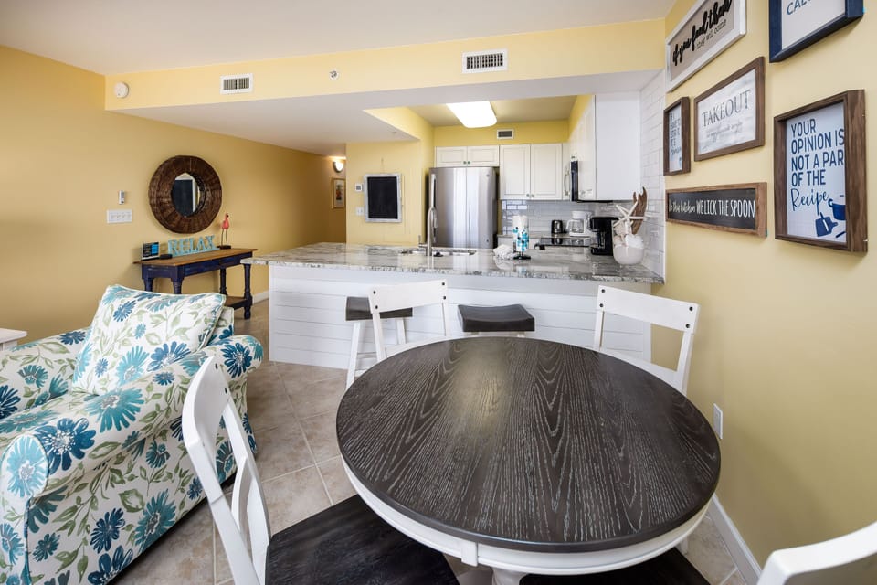 Dining area - Seating for four, with additional seating at the kitchen island.
