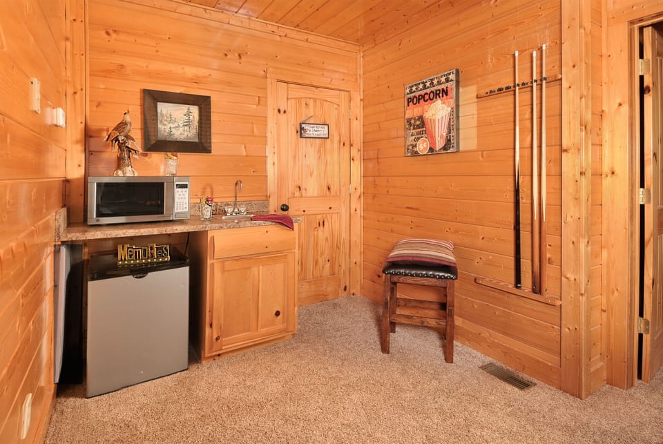 Wet bar with microwave in game room