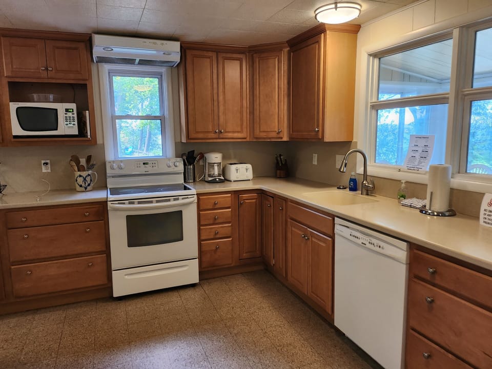 Kitchen - Fully equipped, cooking basics, dishware & flatware, microwave, toaster, drip coffee maker, dishwasher, trash bags, paper towels.