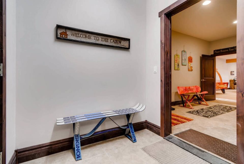 Entry/Lower Level (2) Ski Storage/Mud Rooms to Store Coats and Boots!...Leads to Entertainment Room