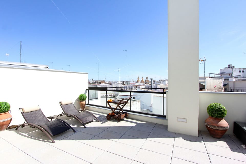 Sunny private terrace with 2 deck chairs.