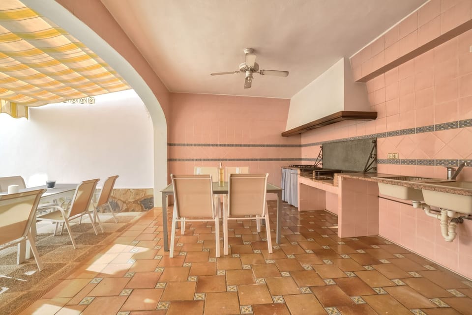 Holiday villa with private pool located in Calpe (Costa Blanca) for 12 people, with six bedrooms and four bathrooms distributed on two independent floors connected by external stairs.INTERIOR: GROUND FLOOR consists of a spacious living room, kitchen with gas hob, a bedroom with double bed, a bedroom with two single beds, a separate bathroom with bathtub and a separate bathroom with shower. The UPPER FLOOR is equipped with a fully equipped kitchen with dishwasher and gas hob, living room, four bedrooms, one with a double bed and the other three with two single beds, and two independent bathrooms with bathtub. The villa has air conditioning in all rooms.EXTERIOR: The villa has a pool with dimensions 8x4, metal stairs and outdoor shower. The pool is surrounded by artificial grass.LOCATION: Located in front of the “Salinas” of Calpe, a privileged area due to its proximity to the various services since a short distance will allow them to access the center of Calpe (2 km), the sandy beach (1 km) and the supermarket (0.5 km).OBERVATIONS: Free WiFi. Pets are allowed up to 12 kg with supplement.