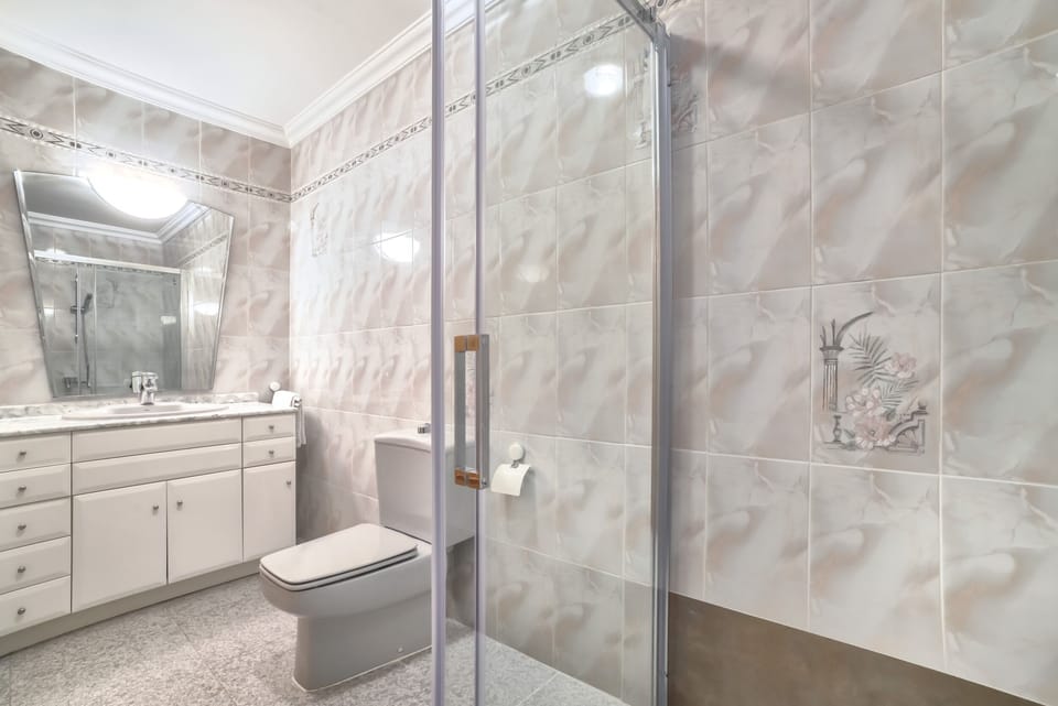 Holiday villa with private pool located in Calpe (Costa Blanca) for 12 people, with six bedrooms and four bathrooms distributed on two independent floors connected by external stairs.INTERIOR: GROUND FLOOR consists of a spacious living room, kitchen with gas hob, a bedroom with double bed, a bedroom with two single beds, a separate bathroom with bathtub and a separate bathroom with shower. The UPPER FLOOR is equipped with a fully equipped kitchen with dishwasher and gas hob, living room, four bedrooms, one with a double bed and the other three with two single beds, and two independent bathrooms with bathtub. The villa has air conditioning in all rooms.EXTERIOR: The villa has a pool with dimensions 8x4, metal stairs and outdoor shower. The pool is surrounded by artificial grass.LOCATION: Located in front of the “Salinas” of Calpe, a privileged area due to its proximity to the various services since a short distance will allow them to access the center of Calpe (2 km), the sandy beach (1 km) and the supermarket (0.5 km).OBERVATIONS: Free WiFi. Pets are allowed up to 12 kg with supplement.