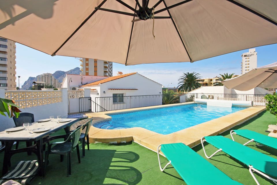 Pleasant summer villa with private pool in Calpe (Costa Blanca) for 12 people, with six bedrooms and four bathrooms, spread over two floors. It has air conditioning in the living room and in all bedrooms.INTERNAL: This villa consists of the GROUND FLOOR, which consists of a living-dining room with TV SAT/TDT, air conditioning, an American bar and access to the terrace and the pool. A fully equipped separate kitchen with dishwasher and ceramic hob. Two bedrooms each with a double bed. There is also a bathroom with a shower. The UPPER FLOOR consists of three bedrooms, each with two single beds, two of them with a bathroom with shower en suite. A double bedroom and finally a washroom.EXTERNAL: A large 10x5 pool fenced for child safety with roman steps and outside shower. There is also a built in barbecue and parking for 4 vehicles on the same property.LOCATION: Without a doubt, an unbeatable location, just 250 m from the nearest supermarket and restaurants. The sandy beach with all services is only 650 m away. There is also a cove 400 m away and Calpe town center 3 km away.REMARKS: Free wifi. Pets up to 12 kg are allowed at an additional cost.