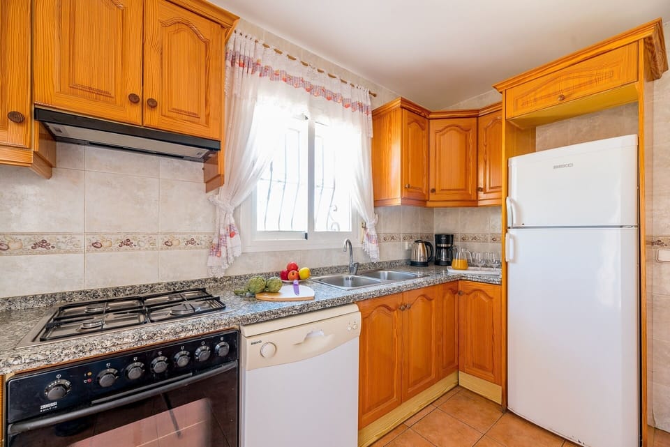 Beautiful villa with private pool located in Calpe (Costa Blanca), for 8 people with four bedrooms and two bathrooms distributed on a single floor (upper floor), since the lower one is closed and uninhabited.INTERIOR: Composed of living room with sat / tdt tv, and access to covered terrace and pool. Fully equipped independent kitchen with dishwasher and gas fires, a bedroom with two single beds, a separate bathroom with a bathtub, a bedroom with a double bed, a bedroom with two single beds, a separate bathroom with a bathtub and washing machine, and finally a bedroom With two single beds.EXTERIOR: It has a closed and partially wooded plot of 700 m² approx. You can enjoy the pool (8x4) of Roman stairs, outdoor shower, barbecue and space for sunbathing in the hammocks. Parking within the same plot for 3-4 vehicles.SITUATION: The villa is located in the urbanization Pla Senieta, quiet urbanization and a few meters from the center of Calpe (0.7 km), the sandy beach (beach and promenade arenal-bol 1.2 km), the shopping center and supermarket (0.7 km) and the tennis club and restaurant (0.4 km).OBSERVATIONS: Free WiFi. Pets are allowed up to 12 kg with supplement.