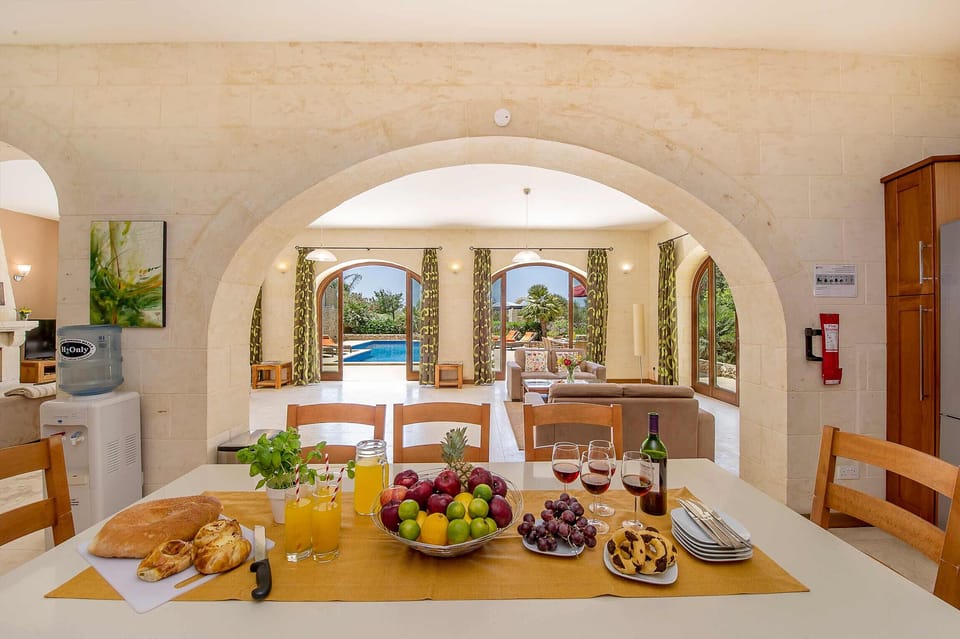 Dining room of The Olives Gozo farmhouse with pool