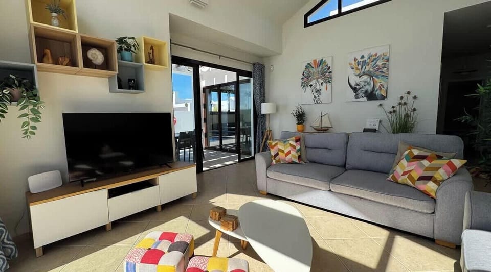 Beautifully furnished living area with French windows leading to your private pool and outdoor terrace.