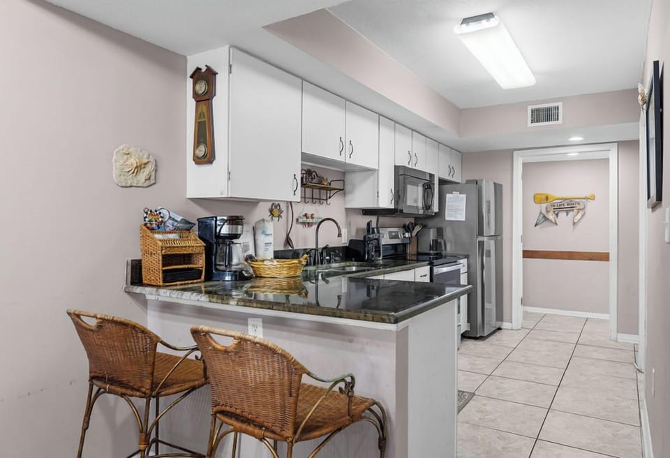 Kitchen - Preparing meals is a breeze in this fully stocked kitchen.