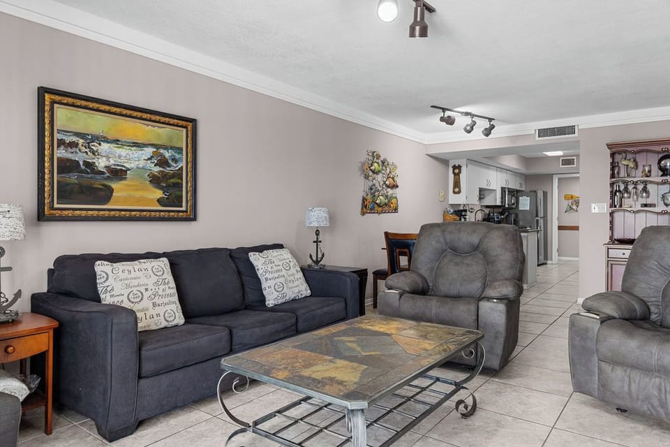 Living Area - The open living area of this beautiful unit features plenty of comfortable seating and a sofa sleeper for additional, overnight guests.