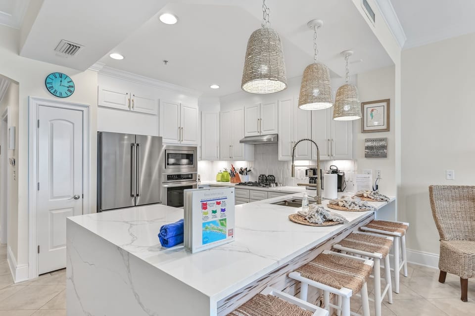 Updated lighting and new countertops/sink - Regular coffee maker, keurig coffee maker, microwave, oven, gas stove top and large double door refrigerator.