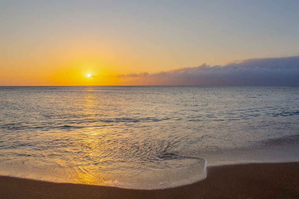 Watch a breathtaking sunset as vibrant colors fill the sky above.