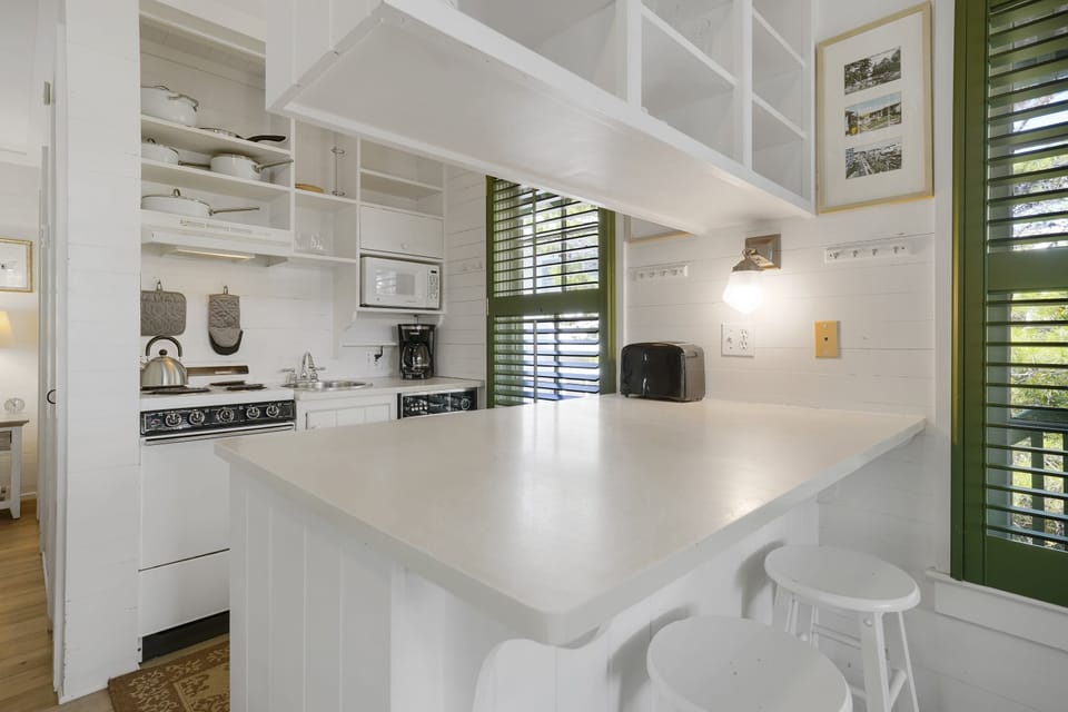 KITCHEN AREA WITH BAR SEATING FOR TWO