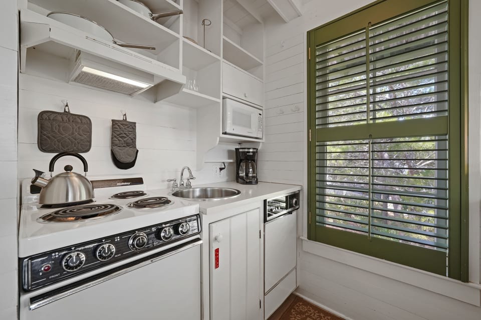 KITCHEN AREA WITH NATURAL LIGHT FROM WINDOW
