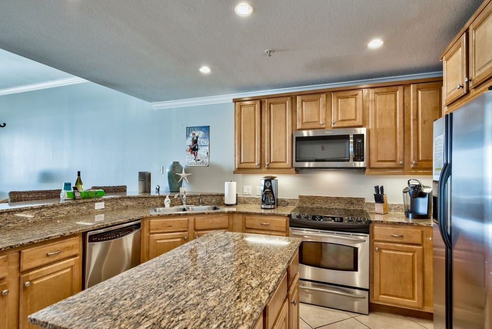 San Remo 402 kitchen - You will find plenty of dish ware, bake ware, pots and pans plus a KEURIG, regular coffee pot plus a blender and so much more.