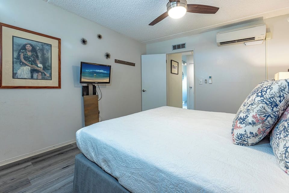 Comfortable king bed in a peaceful Maui retreat.