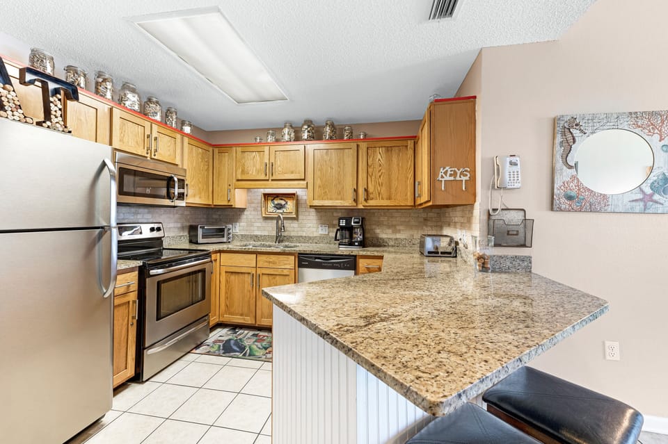 Updated Kitchen with Stainless Steel Appliances, Granite Counter Tops and a Breakfast Bar